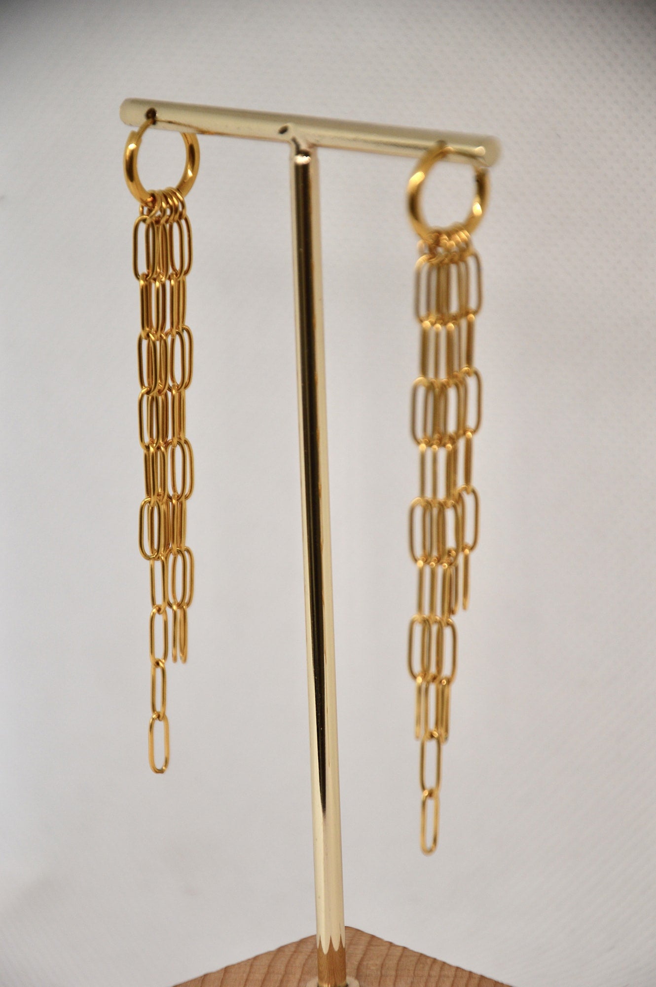 brincos com correntes